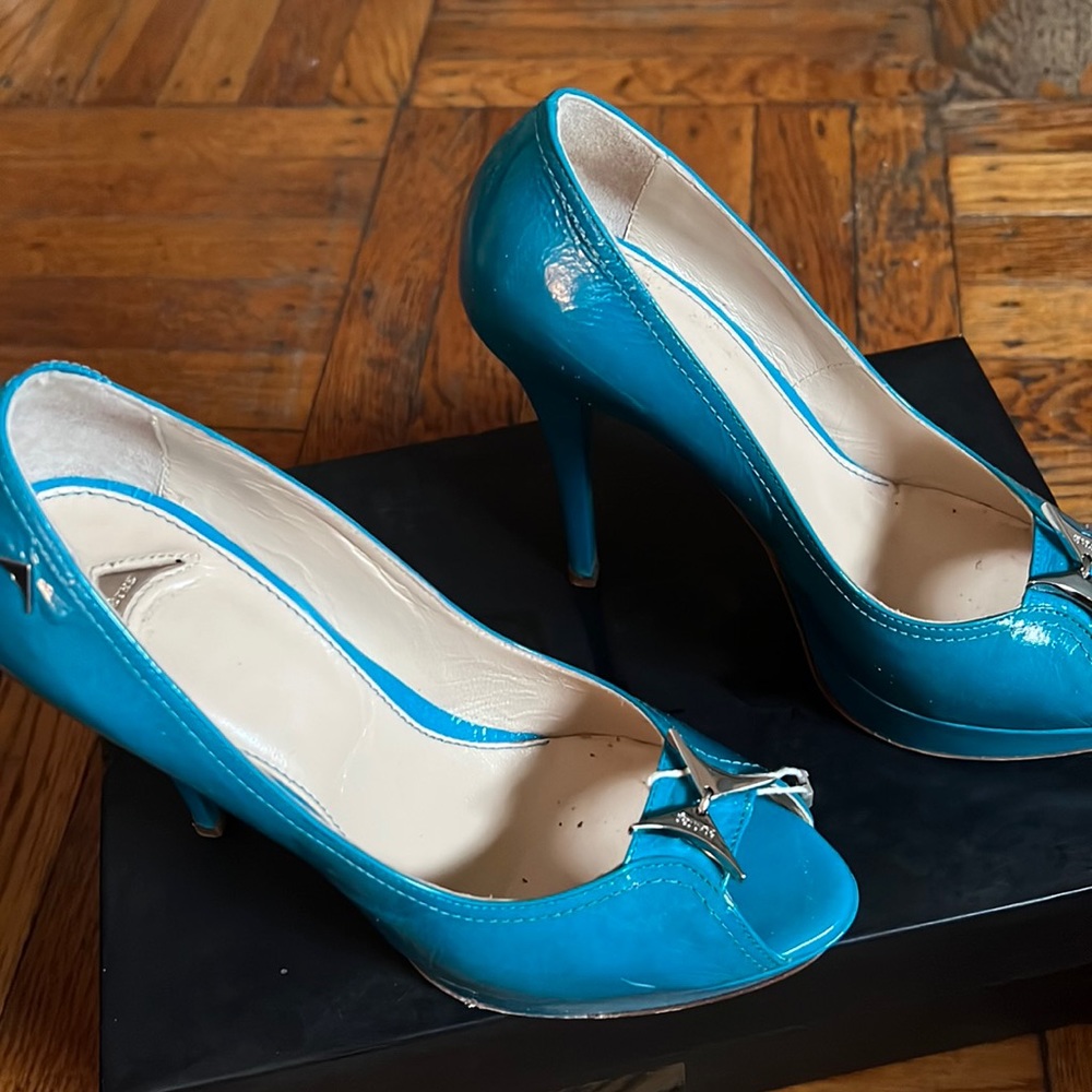 Used Once.  Beautiful Turquoise Size 36 open toe heels.  Made in Italy